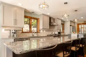 Sleek Gray Cabinetry and Expansive Granite Countertops: A Modern Kitchen Remodel in Belchertown, MA