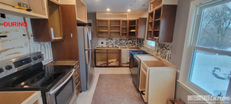 Kitchen during a refacing project with cabinets doors removed installed, showing the progress of construction. Project by Interstate Custom Kitchen & Bath, Inc