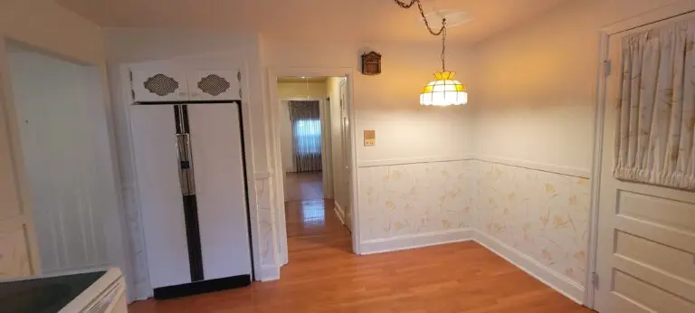 Before kitchen dining area with vintage lighting and existing cabinetry in Longmeadow MA