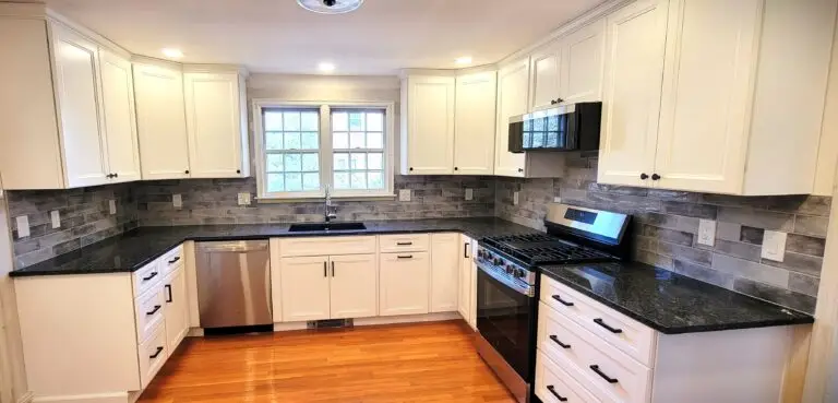 After kitchen wide view with Northpoint Maui Polar White cabinets, granite countertops, and updated layout in Longmeadow MA