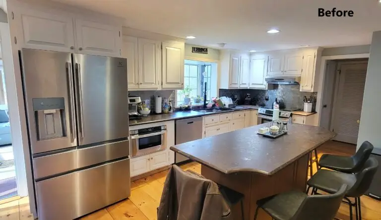 Before kitchen with white cabinets, dark countertops, and outdated backsplash in East Longmeadow MA