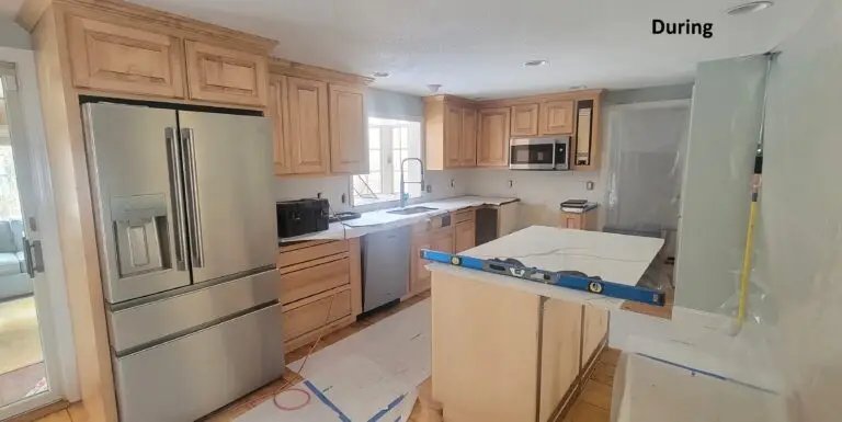 Kitchen during cabinet refacing with new island installation and construction in progress in East Longmeadow MA