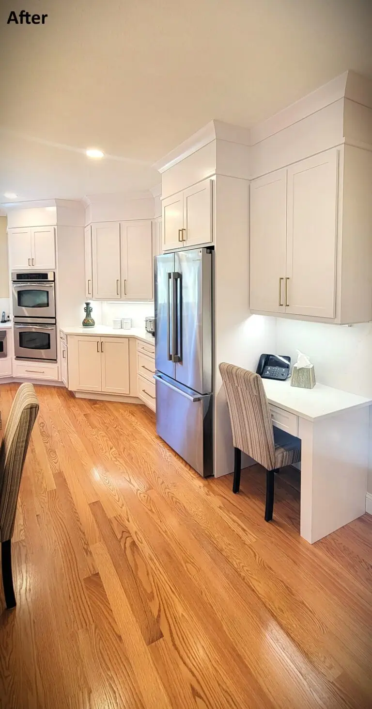 Custom kitchen remodel with white cabinets, gold faucet, quartz island, and modern pendant lighting